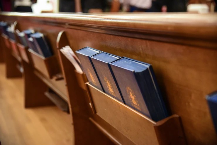 Bibles behind a pew