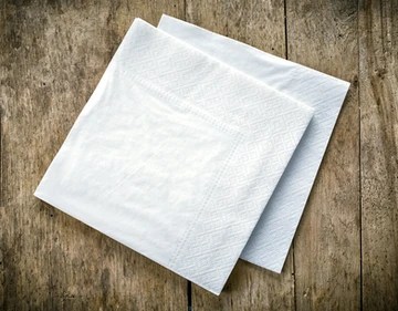 two napkins on a wooden table