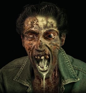 Creepy walking dead rotten and drooling is looking to you hungrily.