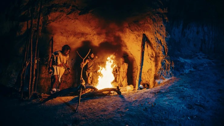 tribe of hunter-gatherers around a fire