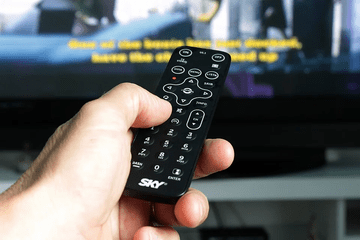remote held in front of TV